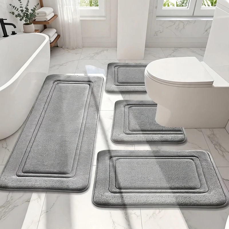 4Ps Advanced Bathroom Mat - Quick-Drying Memory Foam, Machine Washable, Thick Non-Slip Carpet, Suitable for Shower Rooms, Kitchens, And Laundry Rooms - Soft And Comfortable Home Decor 6 A clean front-view image of the 4-piece grey bathroom mat set arranged symmetrically on a bright tile bathroom floor.