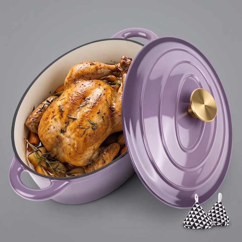 exclusive 4.5QT Enameled Dutch Oven Pot With Lid, Cast Iron Dutch Oven With Dual Handles For Bread Baking, Cooking, Non-stick Enamel Coated Cookware 6 A high-angle, 3/4 view of a beautiful, glossy lavender oval Enameled Dutch Oven Pot With Lid. The pot holds a whole golden-brown roasted chicken surrounded by roasted potatoes and rosemary. The matching lavender lid, featuring a gold-colored knob, is placed next to the pot. In the lower-right corner, there are two small, pyramid-shaped oven mitts with a black-and-white geometric pattern. The entire setup is on a solid grey background.