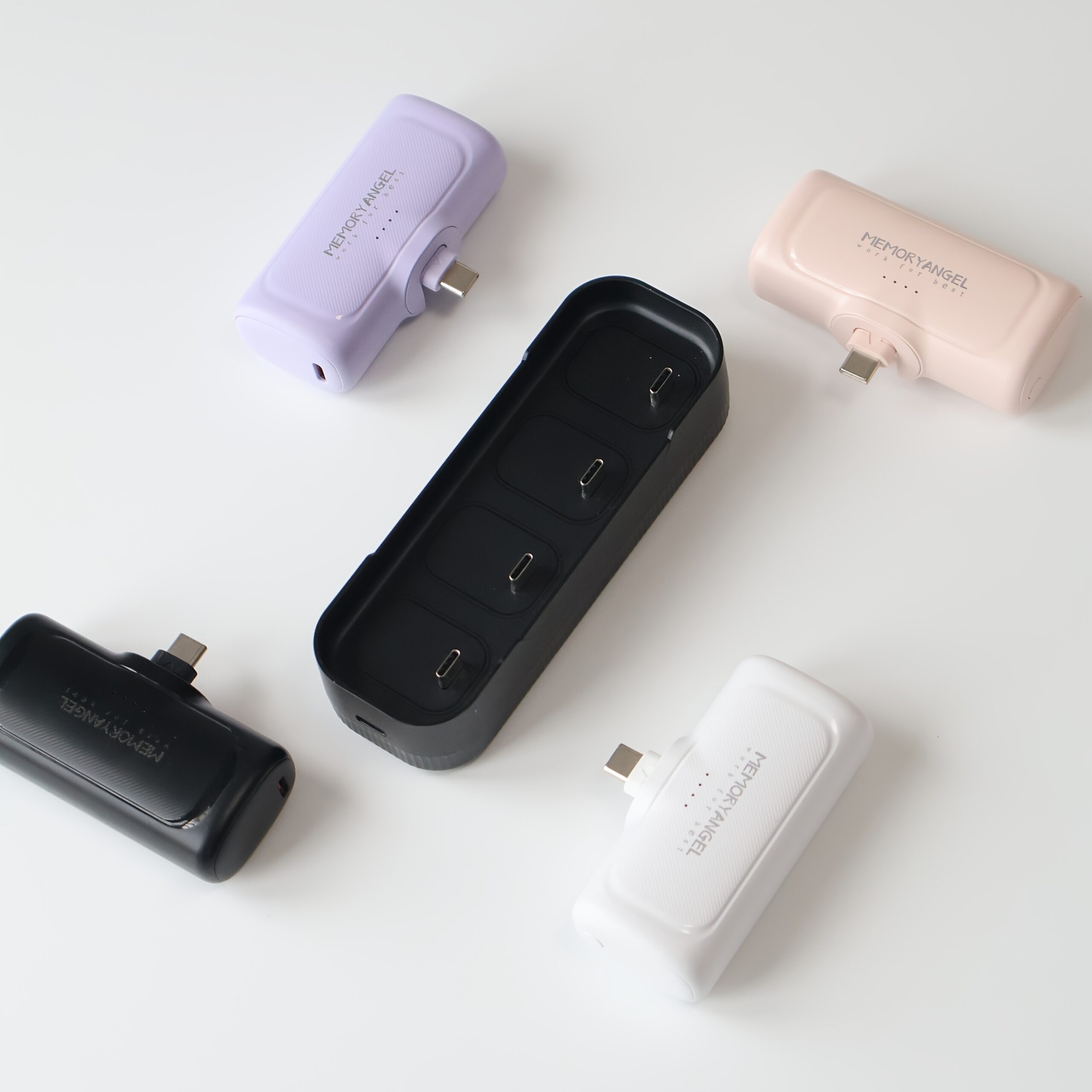 22.5W Fast Charging 5000/10000mAh Mini Portable Charger -5000mAh Optional 1/2/4pcs USB-C Power Bank with Charging Station.The compact desigin 5 Multi-pack of six color-coordinated mini power bank chargers with built-in connectors shown plugged into multiple white smartphones.