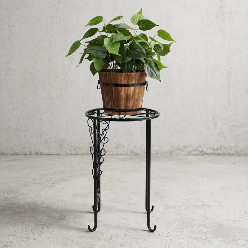 A cozy living room lifestyle view showing a single tall Set Of Metal Plant Racks holding a wooden plant bucket.