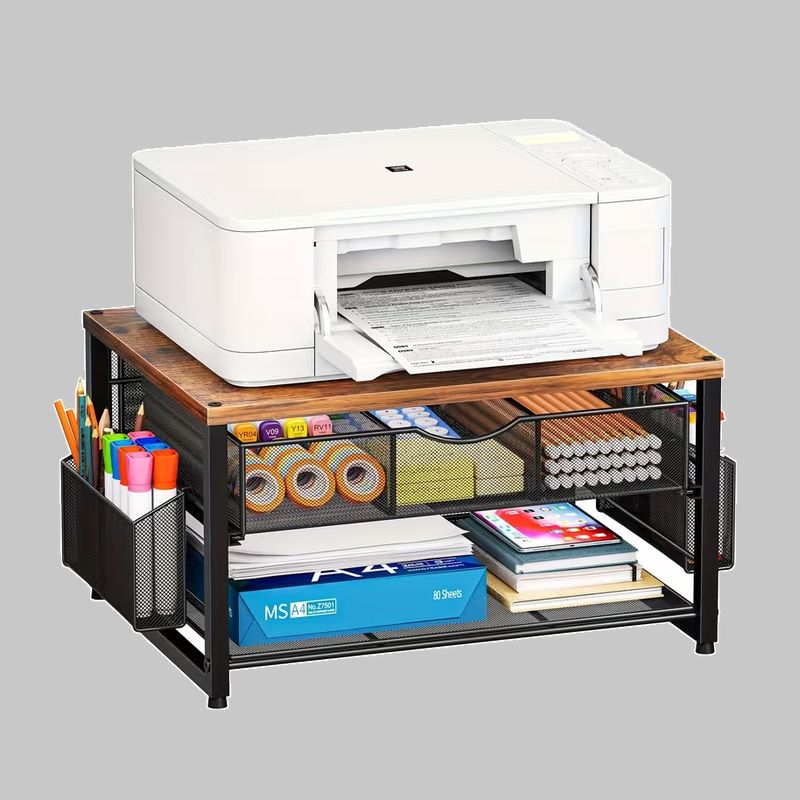 Front view of a wood-grain and black Metal Printer Stand for Desk with Storage loaded with a printer and office supplies.