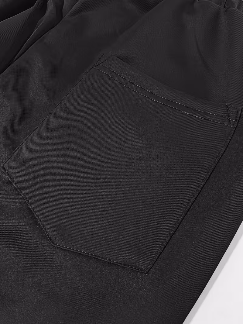 Men'S Color-Blocked Casual Pants Feature a Stylish Design with Comfortable And Structured Fabric. The Drawstring Waist Fits The Body Well, Making It Trendy And Eye-Catching. with a Loose Straight Cut 5 Close-up of the rear pocket on black and grey color blocked casual pants.