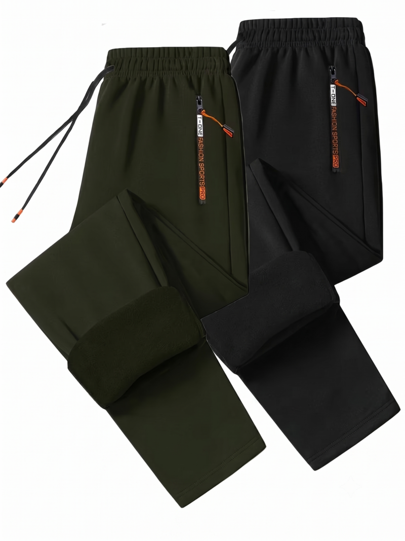 comfortable 2pcs Men's Winter Warm Fleece Sweatpants with Zipper Pockets Casual Trousers Track Pants Drawstring Waist for Running Workout Gym Outdoors for Fall Winter 3 A product shot over a white background showing a two-piece collection of Men's Winter Warm Fleece Sweatpants, featuring one pair in dark army green and another in matte black. The joggers are laid out symmetrically, with the bottom cuffs folded upward to reveal a thick, plush thermal interior fleece lining color-matched to each respective shell. Both waistbands display long matching drawstrings next to high-contrast vertical zipper pockets with orange pulls.