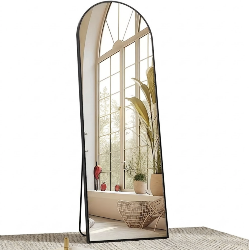 Arched Full Length Mirror with Free Standing & Leaning/Hanging Mount - Tall Vertical Oval Arch Design, Full-Body Mirror Suitable for Living Room, Bedroom, Cloakroom - Modern Simple Aluminum Frame Vertical Mirror 3 A black color Arched Full Length Mirror with Free Standing setup reflecting a sunny arched window and indoor plants in a bright cozy room