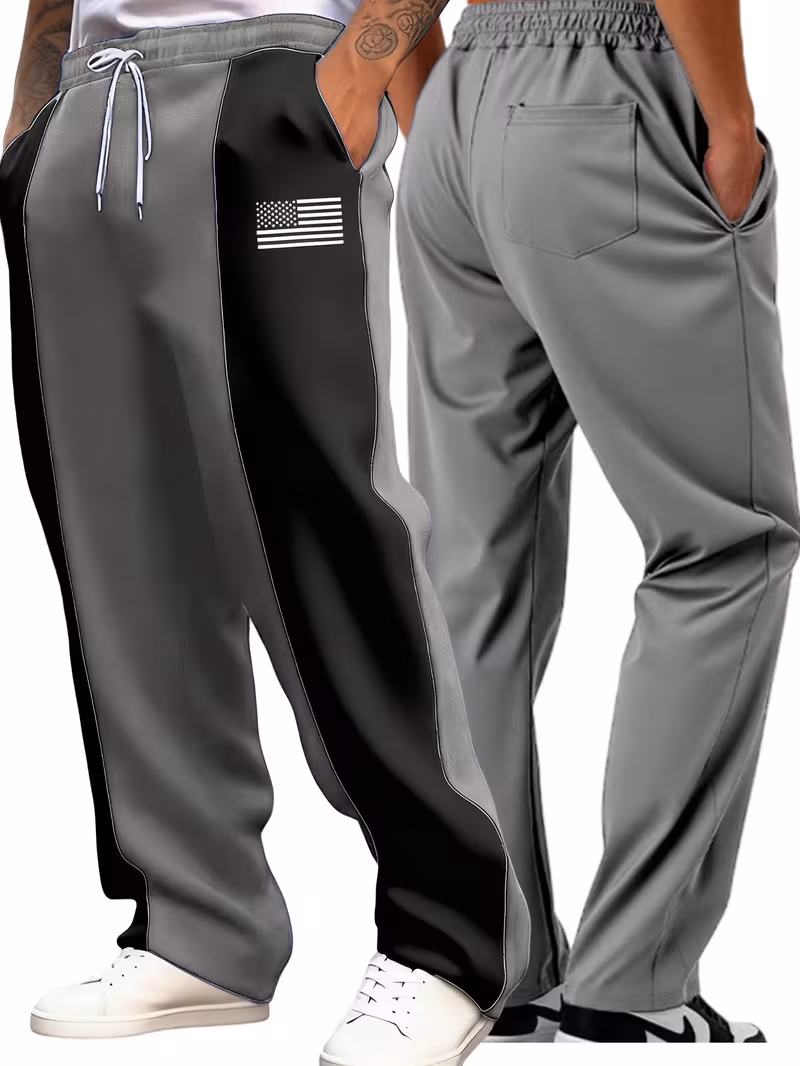 Men'S Color-Blocked Casual Pants Feature a Stylish Design with Comfortable And Structured Fabric. The Drawstring Waist Fits The Body Well, Making It Trendy And Eye-Catching. with a Loose Straight Cut 23 Twin model studio shot showing the front and back fit of the black and gray color-blocked casual pants.
