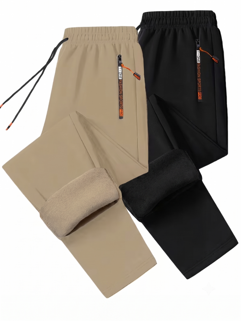 comfortable 2pcs Men's Winter Warm Fleece Sweatpants with Zipper Pockets Casual Trousers Track Pants Drawstring Waist for Running Workout Gym Outdoors for Fall Winter 8 A professional flat lay studio image on a white background showing a two-piece collection of comfortable Men's Winter Warm Fleece Track Pants in khaki and solid black. The joggers are arranged overlapping one another, with the lower leg hems folded up to showcase the thick, color-matched inner fleece insulation lining. The elastic waistbands feature long black drawstrings and high-contrast vertical zippered side pockets with branded pulls and orange cord tabs.