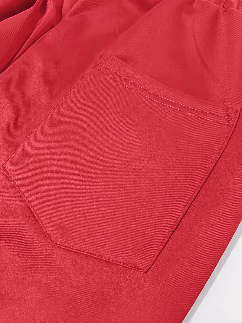 Men'S Color-Blocked Casual Pants Feature a Stylish Design with Comfortable And Structured Fabric. The Drawstring Waist Fits The Body Well, Making It Trendy And Eye-Catching. with a Loose Straight Cut 28 Macro close-up shot of a red patch pocket with durable double-needle stitching on structured activewear pants.