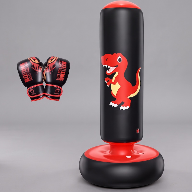 A black and red color inflatable punching bag for kids, featuring a red cartoon dinosaur graphic, stands next to a pair of matching gloves against a neutral grey background.