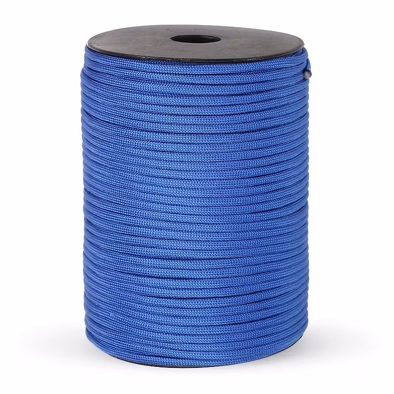 The Ultimate 164ft Roll of 9-Strand Rope 4mm: Heavy-Duty Utility Cord for Tents & Tarps 11 A professional product photograph of a bulk roll of 9-strand paracord rope in a vibrant blue color, neatly wound on a black plastic spool and set against a plain white background.