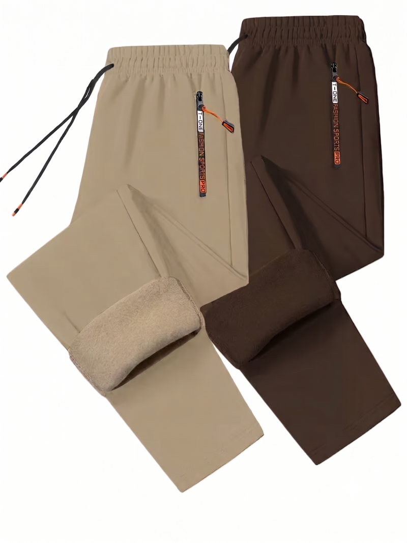 comfortable 2pcs Men's Winter Warm Fleece Sweatpants with Zipper Pockets Casual Trousers Track Pants Drawstring Waist for Running Workout Gym Outdoors for Fall Winter 16 A professional flat lay studio image on a white background showing a two-piece collection of comfortable Men's Winter Warm Fleece Track Pants in khaki and solid brown. The joggers are arranged overlapping one another, with the lower leg segment of both pairs folded up to showcase the thick, color-matched inner fleece insulation lining. The elastic waistbands feature long black drawstrings and high-contrast vertical zippered side pockets with branded pulls and orange cord tabs.