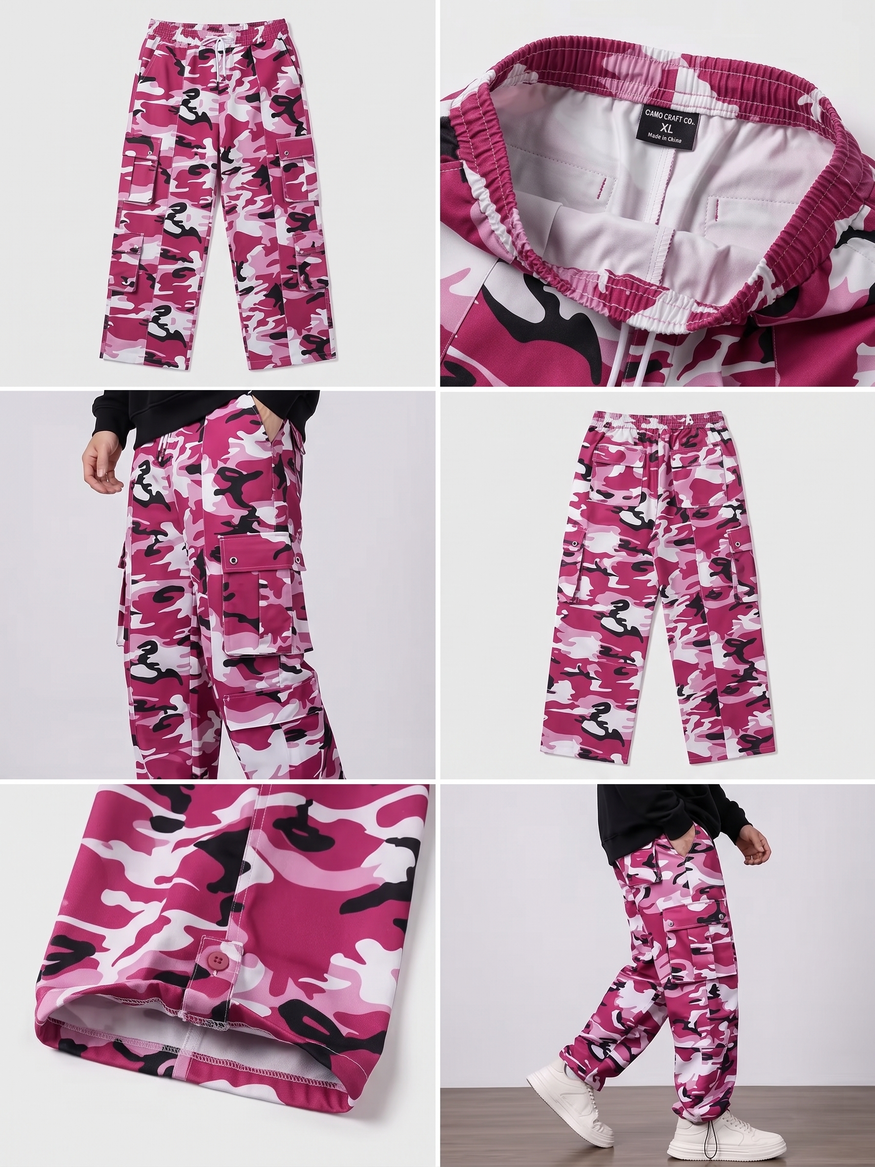 practical Men's Camouflage Print Multi-Pocket Cargo Pants, Elastic Waistband with Adjustable Legs, Fashion Wide-Leg Trousers 19 A close-up quarter-view photograph from the left, showing a person's lower body from the waist down wearing dark pink (fuchsia) camouflage wide-leg cargo pants. Their hands are clasped in front. The fuchsia, light pink, white, and black camouflage print is vibrant. Two cargo pockets are visible on the left leg, one above the other. A glimpse of white sneakers is at the bottom. The background is simple white wall and a dark wood floor.