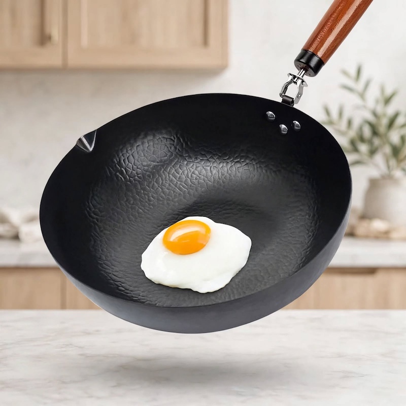 practical Cast Iron Frying Pan Wok Set - Nonstick, 12.6 Inch Pan With 13 Cookware Accessories, Suitable For All Stoves, Kitchen Utensils, Kitchen Tools, Kitchen Accessory, Kitchen Supplies Camping 4 A single fried egg sitting neatly inside a black hammered Cast Iron Frying Pan Wok Set held up in a kitchen setting.