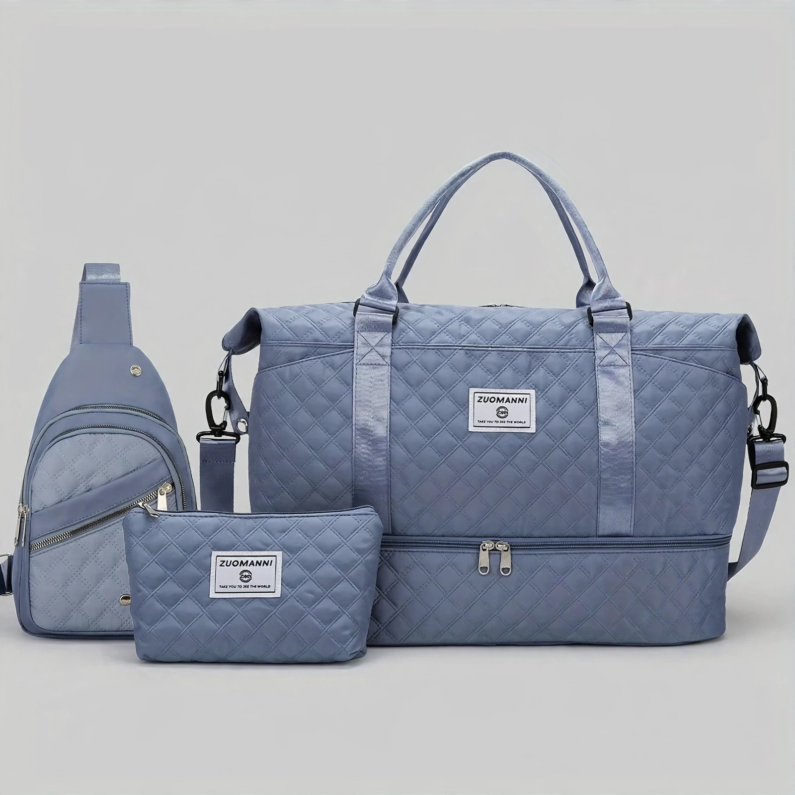 A Three-Piece Travel Set Including a Tote Bag, a Toiletry Bag, And a Shoulder Bag, Featuring a Spacious Independent Shoe Compartment, Perfect for Outdoor Fitness, Travel, Overnight Stays, And Weekend Trips 17 A studio product shot against a light gray background displaying a fog blue color tote bag set, including a large travel bag with a bottom zipper pocket, a sling bag, and a pouch.
