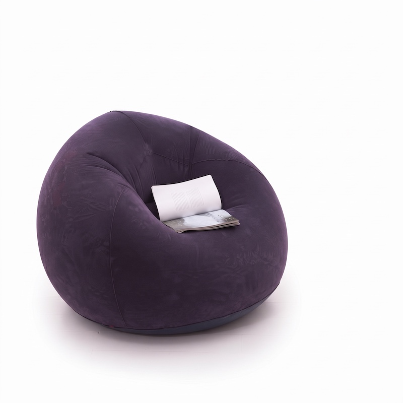 A Large Inflatable Lazy Sofa Chair, Made of PVC Bean Bag Material, Suitable for Indoor And Outdoor Seating 9 A large, blue inflatable bean bag chair with an open white book resting on the seat against a white background.