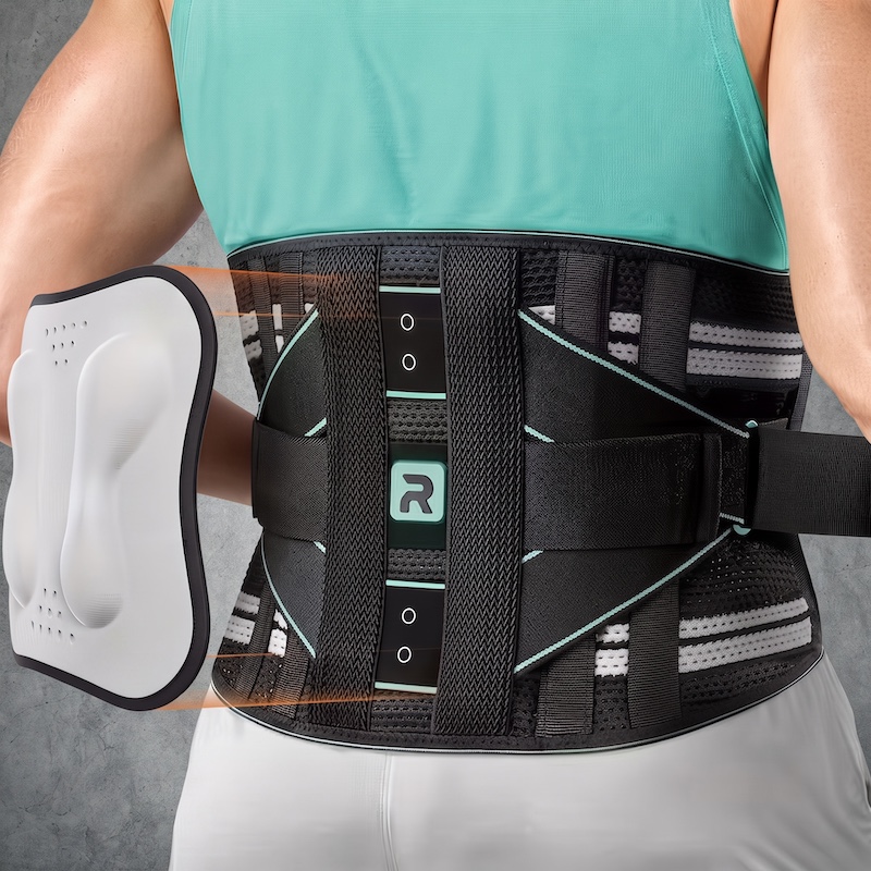 Rear view of a person wearing a black and teal mesh back brace, with an orange arrow pointing to a separate white lumbar pad.Title: Blue Powerful Lumbar Support Back - Bracing Technology