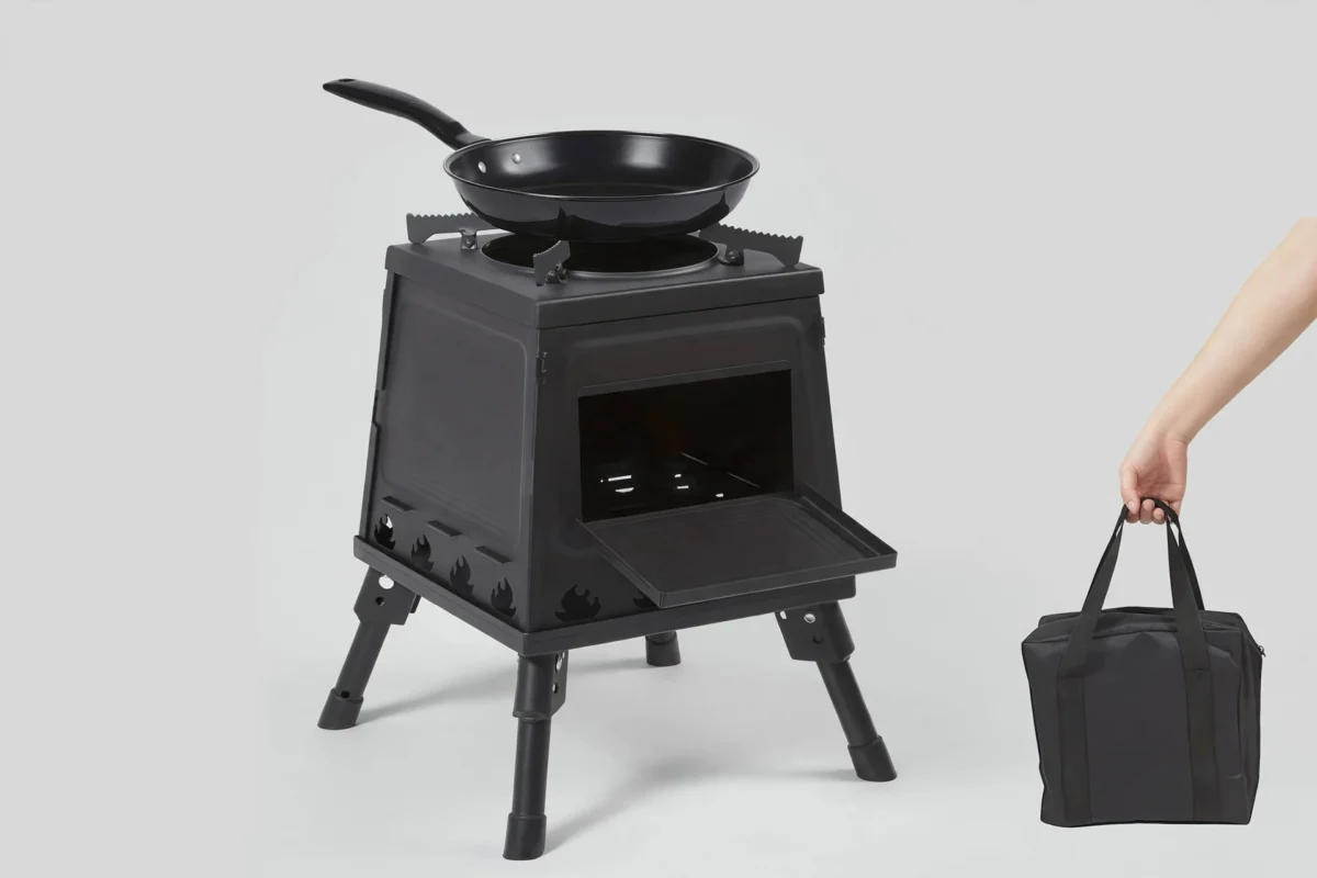 Portable Wood Burning Camp Stove - Heavy-Duty Outdoor Campfire Stove with Sturdy Legs & Air Vents, Firewood/Bonfire Compatible for Hiking, Backpacking, Picnic, BBQ, Travel - No Electricity/Flint/Magnesium Needed 5 Portable Wood Burning Camp Stove paired with a frying pan and carry bag in a studio setting