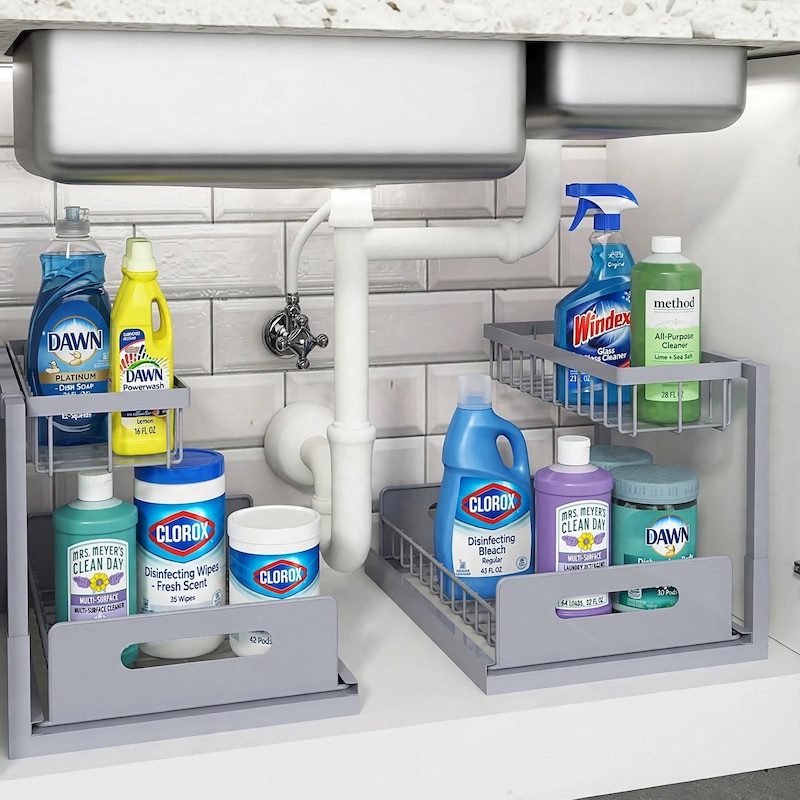 Twin gray 2pack Metal Under Sink Organizers installed beneath a kitchen sink, neatly holding dish soap, cleaning sprays, and wipes.