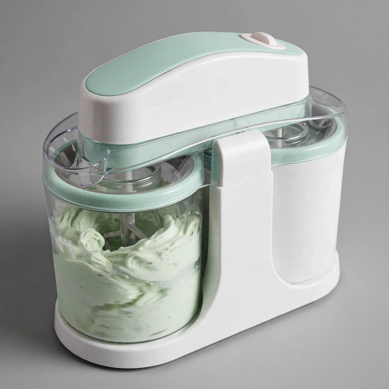 Home Ice Cream, Detachable Design for Easy Cleaning, Perfect for Making Homemade Ice Cream, Smoothies And Frozen Yogurt, 1QT, Party, Summer Essentials, Halloween And Christmas Gifts Suitable for Giving 1 Front view of a mint green Home Ice Cream machine actively churning a batch of light green frozen dessert in a transparent container.