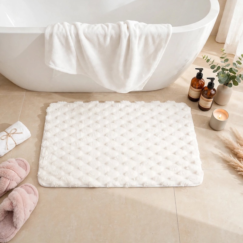 Front layout view of a white 23.62inchx40c Soft Long-Haired Bathroom Non-Slip Mat placed on a clean floor near a white bathtub.