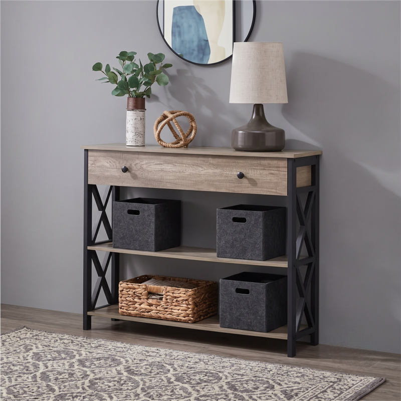 A gray color table with drawer and storage shelves stands against a light wall, featuring stylized decor and baskets.