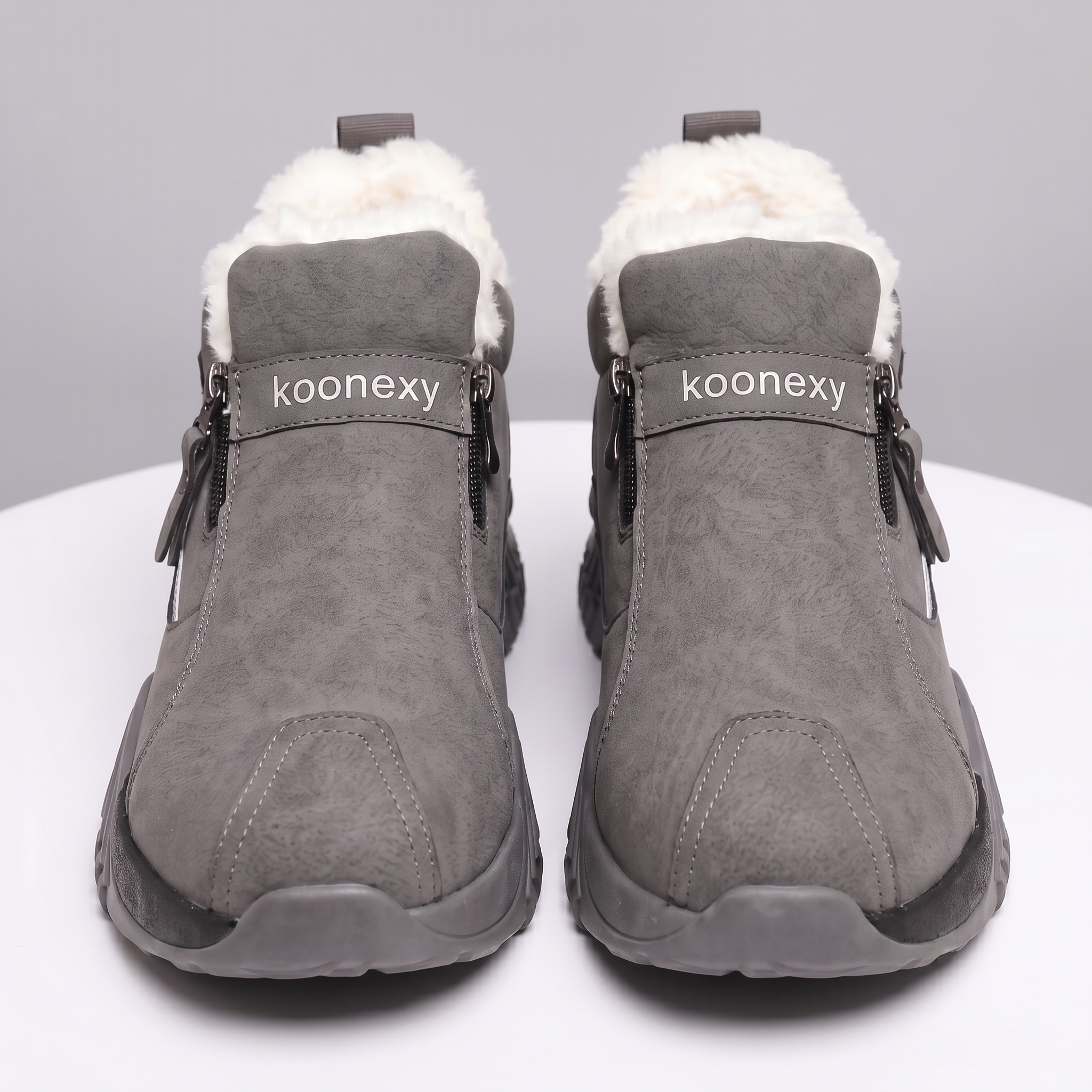 Winter Men'S Thermal Insulated Fleece-Lined Snow Boots - Comfortable, Breathable, And Stylish Hiking Shoes, Short Men'S Boots Suitable for Hiking, Hunting, Work Commuting, And Casual Wear, Winter Boots, Outdoor Footwear - Available in Black/Gray/Kha 8 A direct front-facing studio shot of a pair of grey color Insulated Fleece-Lined Snow Boots standing side-by-side on a white surface. The image highlights the thick, white fleece lining protruding from the collar, the smooth faux-suede upper, and the debossed strap branding featuring the word "koonexy" in clean white lettering.