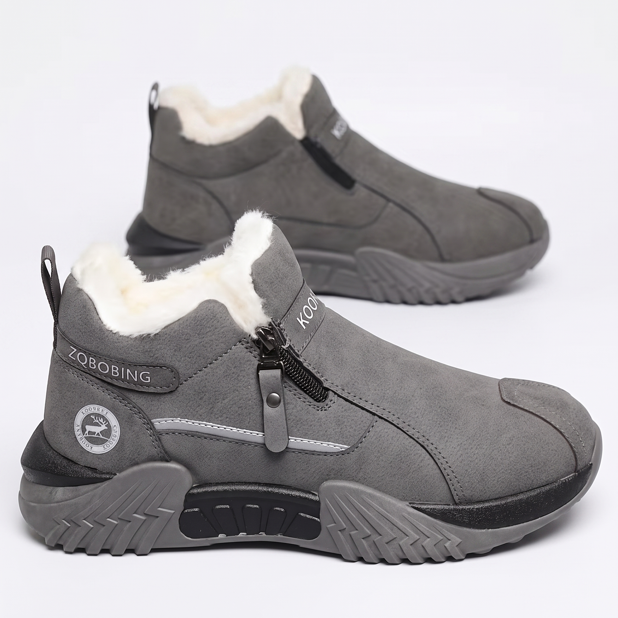 Winter Men'S Thermal Insulated Fleece-Lined Snow Boots - Comfortable, Breathable, And Stylish Hiking Shoes, Short Men'S Boots Suitable for Hiking, Hunting, Work Commuting, And Casual Wear, Winter Boots, Outdoor Footwear - Available in Black/Gray/Kha 10 A dynamic side profile view of a grey color Insulated Fleece-Lined Snow Boot, displaying the "ZQBOBING" side strap, a circular deer logo on the lower heel, and a multi-textured grey and black outsole. A secondary boot is positioned behind to provide depth against a plain white backdrop.