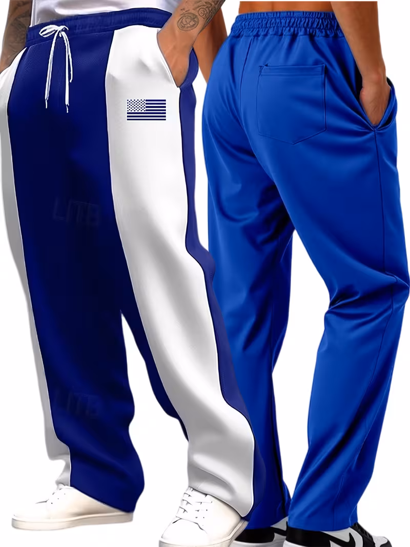 Men'S Color-Blocked Casual Pants Feature a Stylish Design with Comfortable And Structured Fabric. The Drawstring Waist Fits The Body Well, Making It Trendy And Eye-Catching. with a Loose Straight Cut 40 Studio model view showcasing the front three-quarter fit of light blue and white color-blocked tech-fleece casual pants.
