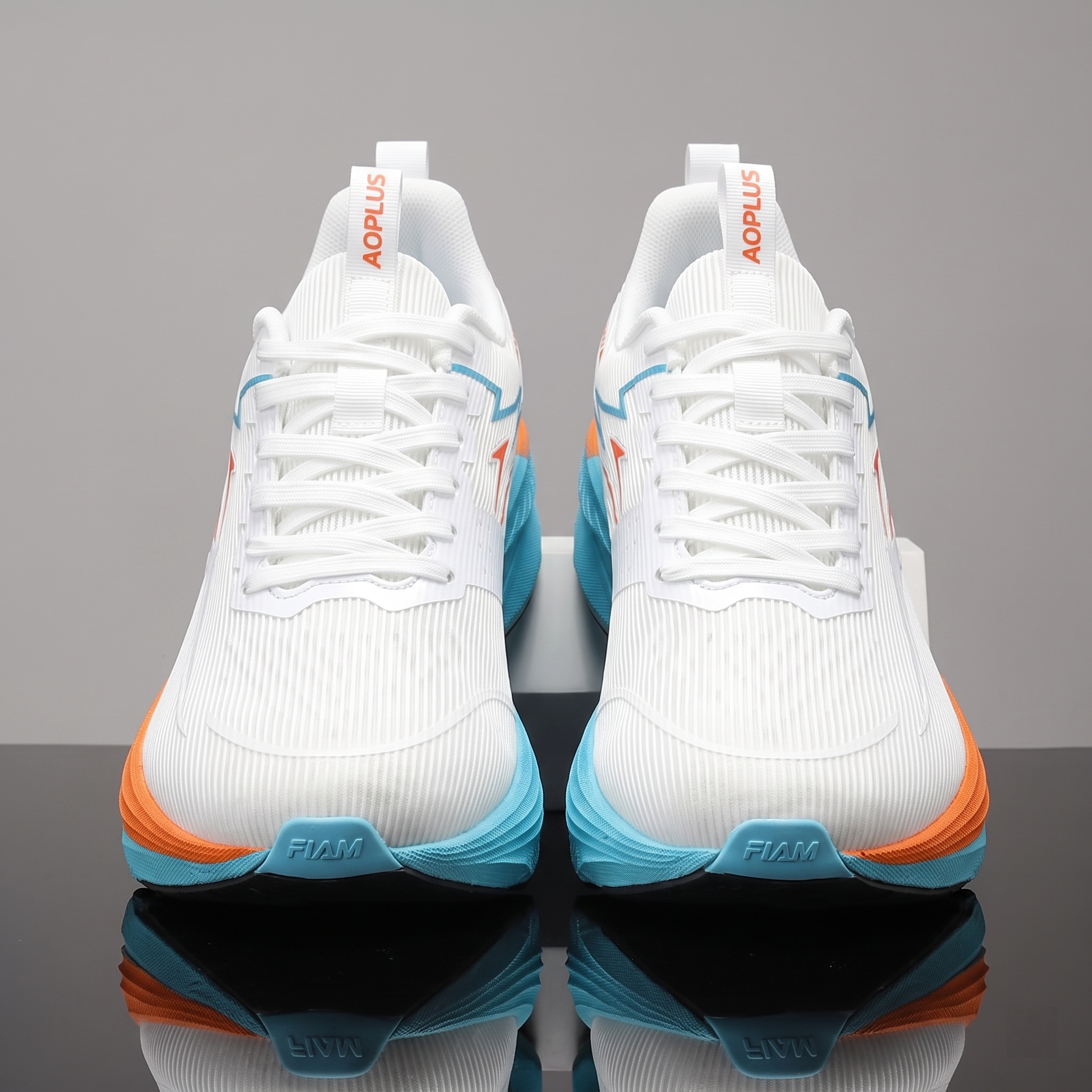 exclusive Men'S Fashion Lightweight Breathable Casual Sports Shoes | Low-Top Fabric Upper, Rubber Sole, Lace Closure, Suitable for All Seasons And Daily Wear 11 ymmetrical front-facing view of a pair of white orange color Lightweight Breathable Casual Sports Shoes with white laces and orange tongue text on a reflective surface