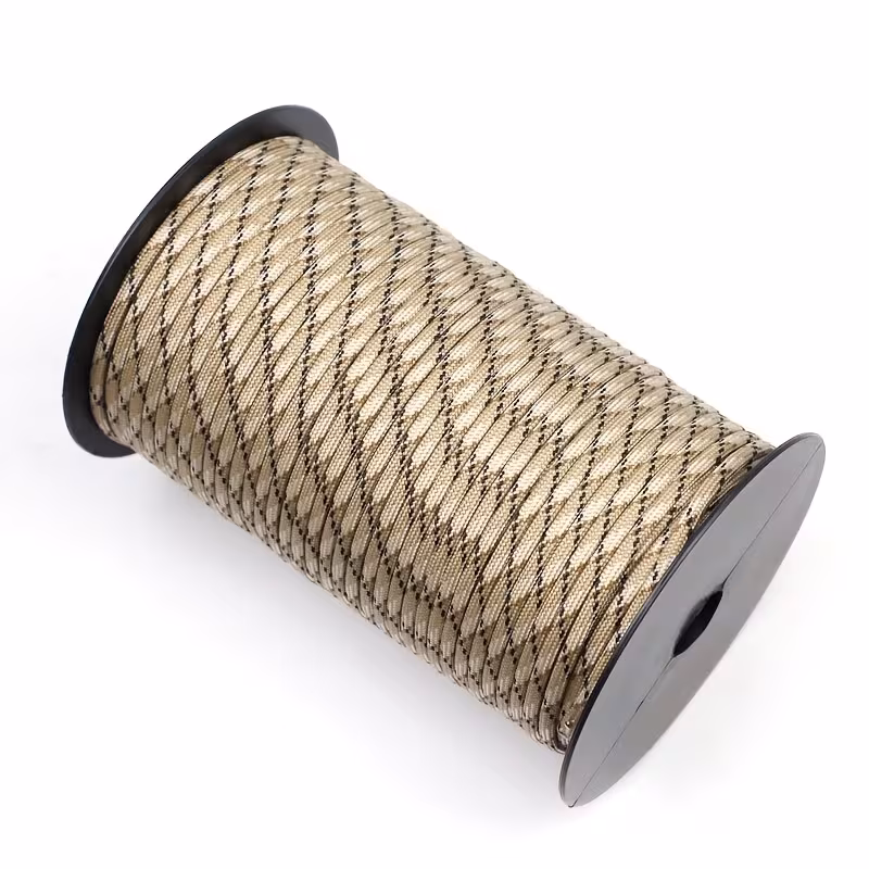 The Ultimate 164ft Roll of 9-Strand Rope 4mm: Heavy-Duty Utility Cord for Tents & Tarps 24 A full spool of durable 4mm tactical paracord with a beige and black diamond pattern, representing a bulk Roll of 9-Strand Rope 4Mm.
