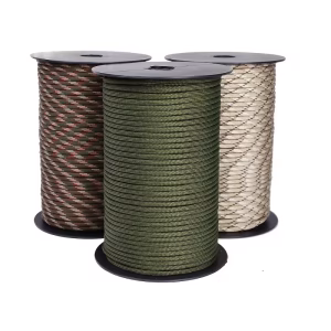 Three spools of premium utility cord, including solid olive green, woodland camouflage, and desert tan patterns, showcasing the variety available in this Roll of 9-Strand Rope 4mm.