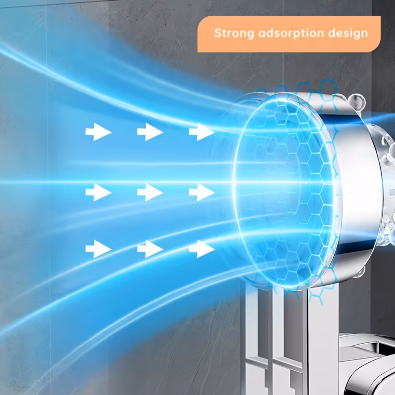 A professional technical visualization of the Shower System with a Rudder-Shaped suction base. The graphic illustrates the "Strong adsorption design" utilizing blue kinetic energy streams and arrows pointing toward the transparent rudder-shaped dial. A hexagonal grid overlay on the suction diaphragm represents the microscopic structural integrity and vacuum-seal distribution. The hardware is finished in a high-polish silvery chrome, staged against a dark, textured slate-tile wall. The visualization emphasizes the zero-friction atmospheric lock that secures the bracket to the substrate.