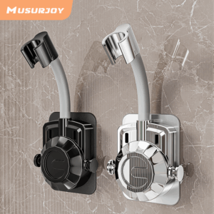 This image displays two versions of an adjustable Wall Mounted Shower Head Bracket mounted on a gray marble-patterned tile wall. One bracket is matte black, and the other is a reflective chrome/silver finish. Both feature a textured circular base, side adjustment knobs, and a curved arm with a cradle for a handheld shower head. The brand name 'MUSURJOY' is in the top left corner.