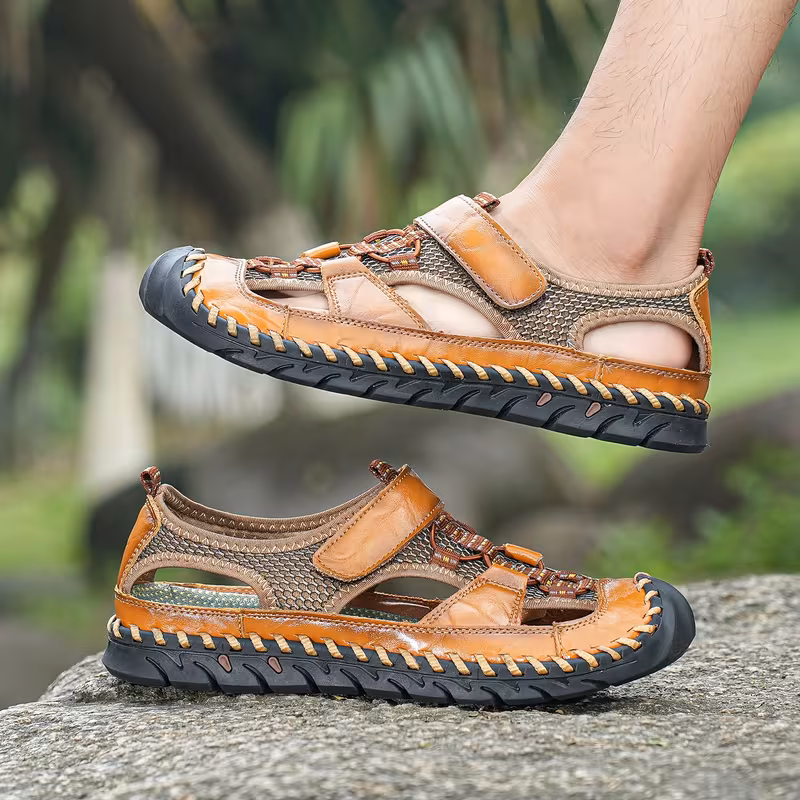 All-Terrain Casual Sports Sandals: Solid Color, Slip-Resistant Rubber Sole & Breathable Fiber Upper 13 A pair men's Casual Sports Sandals Solid Color with black soles, viewed from a slightly elevated three-quarter front angle, standing on a light textured concrete surface.