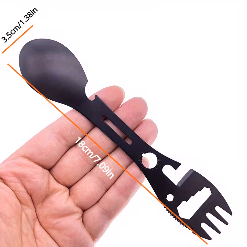 practical Precision Logistics Component: Outdoor Fork Spoon Detachable Tableware with Modular Separation Logic—High-Standard Multi-Tool for Hiking and Remote Cabin Coordination 7 A technical product visualization of the Outdoor Fork Spoon Detachable Tableware staged on a rugged stone substrate. The device is shown in its detached state, separated into two independent hardware units. One side features a matte black fork integrated with a bottle opener and "Qishing 10 in 1" branding; the second unit features a matching spoon and a deployed serrated stainless steel blade. Both components utilize a high-impact textured polymer handle for high-fidelity grip coordination.