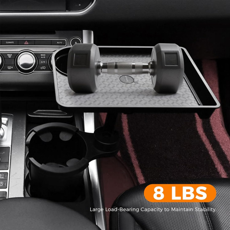 Operational Infrastructure Node: Car Cup Holder Expansion Tray with 40lb Load Capacity and 360° Rotating Mechanical Base for Superior Cabin Utility 3 A professional product stress-test photograph of the Car Cup Holder Expansion Tray installed in a vehicle console. A heavy 8 lb black dumbbell is placed centrally on the expansion tray's textured gray surface to demonstrate structural rigidity. The matte black hardware remains level and stable, anchored firmly into the primary cup holder node. An orange graphic overlay displays "8 LBS" with the subtext "Large Load-Bearing Capacity to Maintain Stability." The focus is sharp on the reinforced swivel arm and the non-slip tray inlay, highlighting the hardware's resistance to gravitational oscillation and tilting.