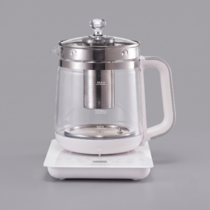 A clean product photo of the Electric Kettle 1.8L/60.87oz in its transparent glass pot and on its white control base. The central transparent kettle is clearly labeled with "MAX 1000ml" and "MIN" water level indicators, though the total capacity is stated as 1.8L in the surrounding text. The detachable stainless steel infuser is visible inside the water-filled pot. The control base features simple touch icons and "Valulu" text. The background is a solid grey.